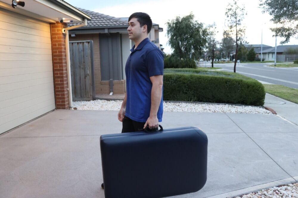 An image of James en route to the patient's house with a mobile treatment table